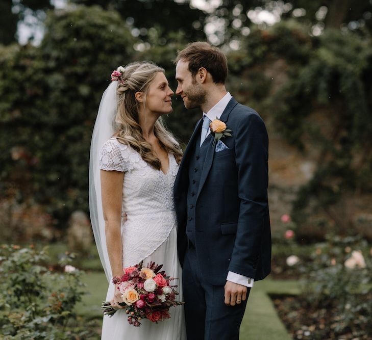 Bride in a Temperley Cressida Gown | Groom in Sandro Suit | Rural Wedding in a Sailcloth Tent on Stanford Hall Estate, Northamptonshire | Rebecca Goddard Photography