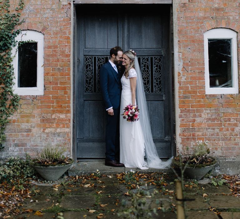 Bride in a Temperley Cressida Gown | Groom in Sandro Suit | Rural Wedding in a Sailcloth Tent on Stanford Hall Estate, Northamptonshire | Rebecca Goddard Photography