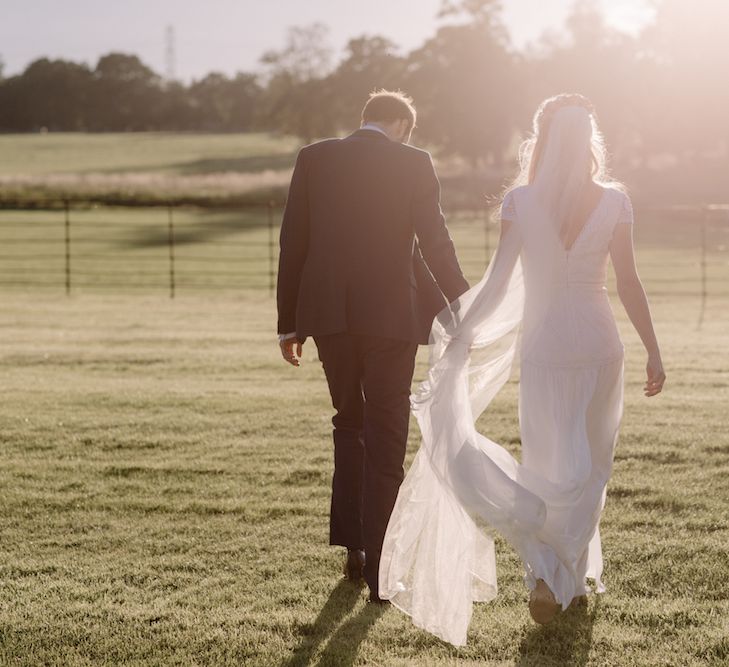 Bride in a Temperley Cressida Gown | Groom in Sandro Suit | Rural Wedding in a Sailcloth Tent on Stanford Hall Estate, Northamptonshire | Rebecca Goddard Photography