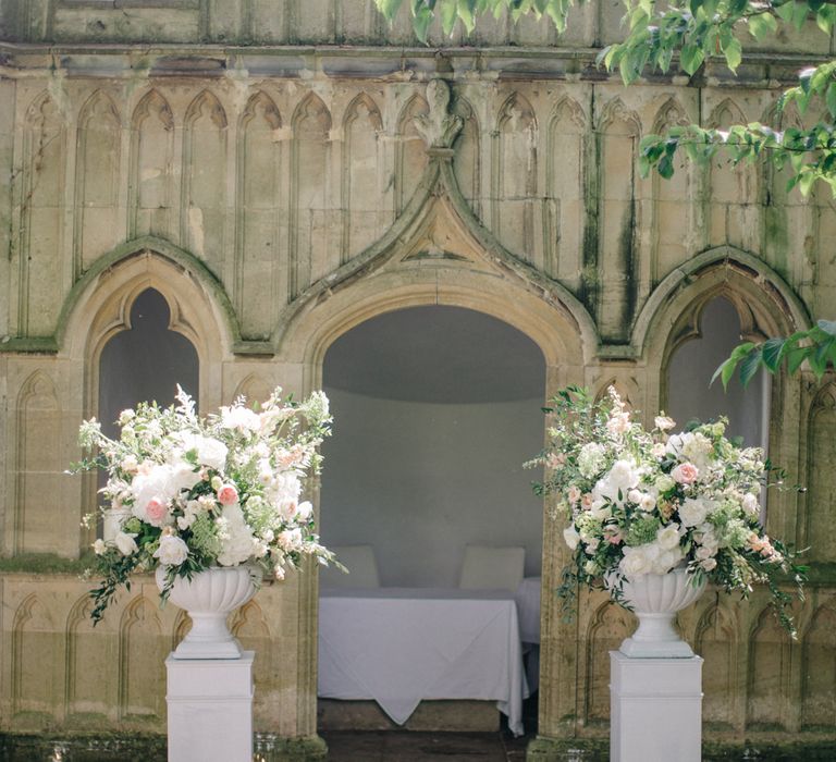 Ceremony Flower Arrangements | Outdoor Pastel Country Garden Wedding at Barnsley House in Cirencester | M and J Photography | Motion Farm Wedding Films