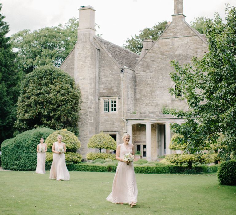 Bridesmaids Entrance in Pink Dessy Dresses | Outdoor Pastel Country Garden Wedding at Barnsley House in Cirencester | M and J Photography | Motion Farm Wedding Films