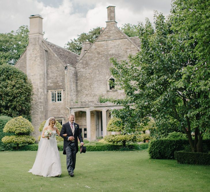 Bridal Entrance in Lace Wedding Dress | Outdoor Pastel Country Garden Wedding at Barnsley House in Cirencester | M and J Photography | Motion Farm Wedding Films