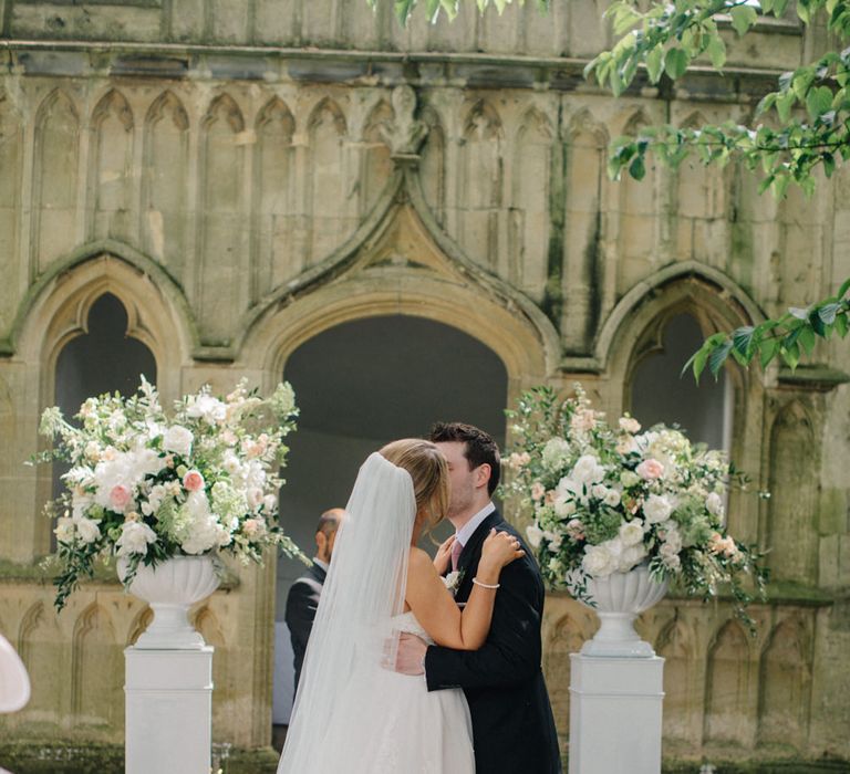 Wedding Ceremony | Bridein Princess Gown | Groom in Top Hat & Tails | Outdoor Pastel Country Garden Wedding at Barnsley House in Cirencester | M and J Photography | Motion Farm Wedding Films