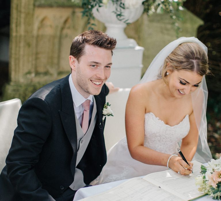 Wedding Ceremony | Bridein Princess Gown | Groom in Top Hat & Tails | Outdoor Pastel Country Garden Wedding at Barnsley House in Cirencester | M and J Photography | Motion Farm Wedding Films