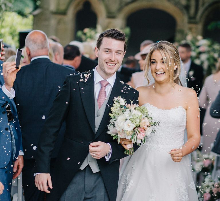 Wedding Ceremony | Bridein Princess Gown | Groom in Top Hat & Tails | Outdoor Pastel Country Garden Wedding at Barnsley House in Cirencester | M and J Photography | Motion Farm Wedding Films