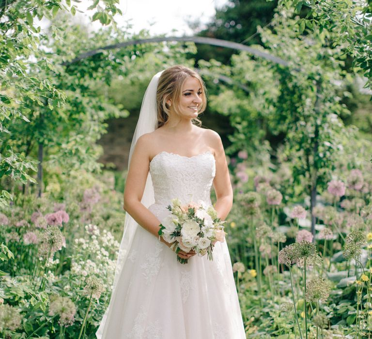 Beautiful Bride in Princess Gown | Outdoor Pastel Country Garden Wedding at Barnsley House in Cirencester | M and J Photography | Motion Farm Wedding Films