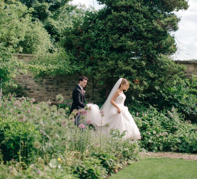 Bride in Lace Princess Gown | Groom in Traditional Morning Suit | Outdoor Pastel Country Garden Wedding at Barnsley House in Cirencester | M and J Photography | Motion Farm Wedding Films