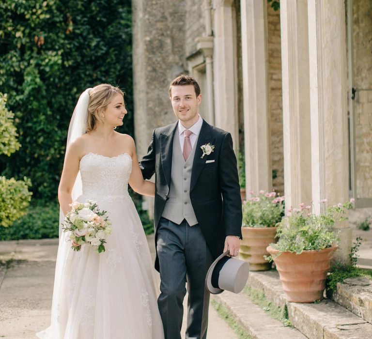 Bride in Lace Princess Gown | Groom in Traditional Morning Suit | Outdoor Pastel Country Garden Wedding at Barnsley House in Cirencester | M and J Photography | Motion Farm Wedding Films