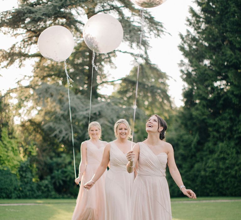 Giant Balloons | Bridesmaids in Blush Dessy Bridesmaid Dresses | Outdoor Pastel Country Garden Wedding at Barnsley House in Cirencester | M and J Photography | Motion Farm Wedding Films