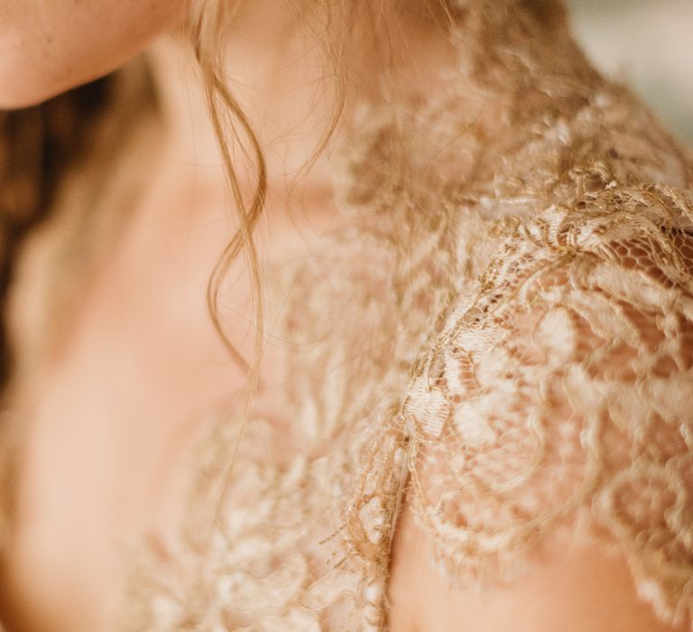 Gold lace Amanda Wakeley dress detail.