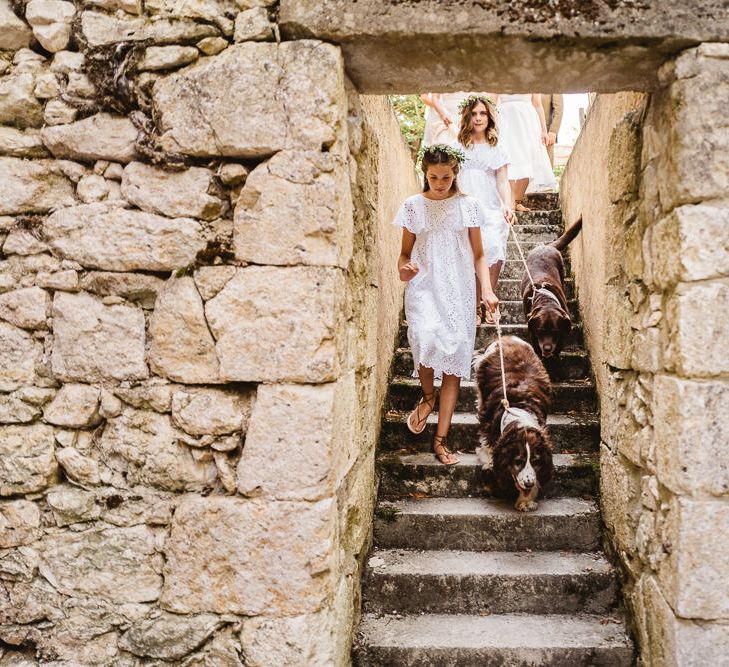 Beautiful little girl bridemaids. Idylic outdoor french wedding ceremony. Photography by Derek Smietana