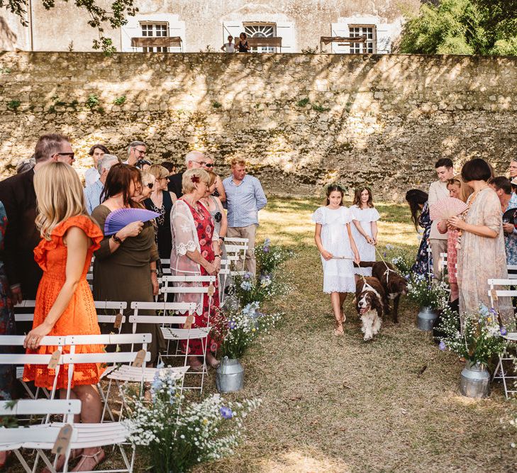 Idylic outdoor french wedding ceremony. Photography by Derek Smietana