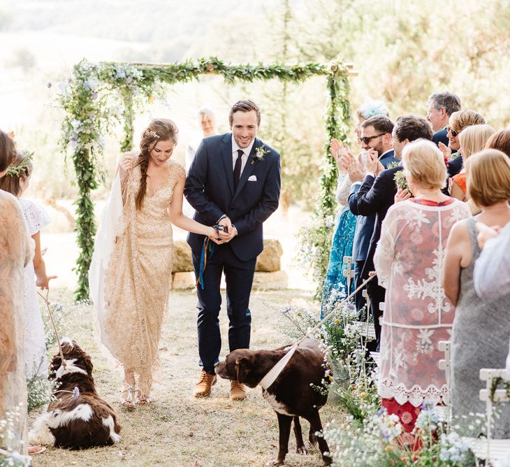 Floral wedding arch. Photography by Derek Smietana