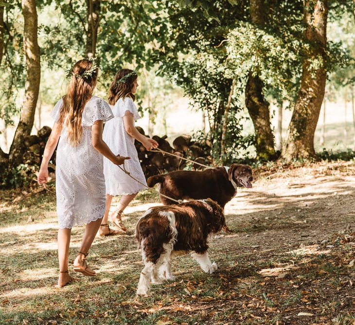 Bridesmaids in pretty white dresses. Photography by Derek Smietana