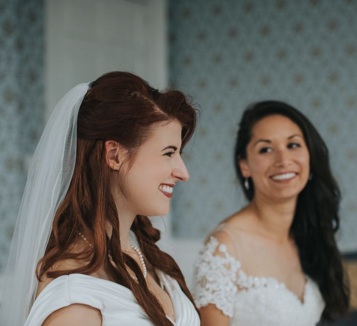 Two Brides in Ocean Bridal Studio Wedding Dress & White Leaf Bridal Wedding Dress