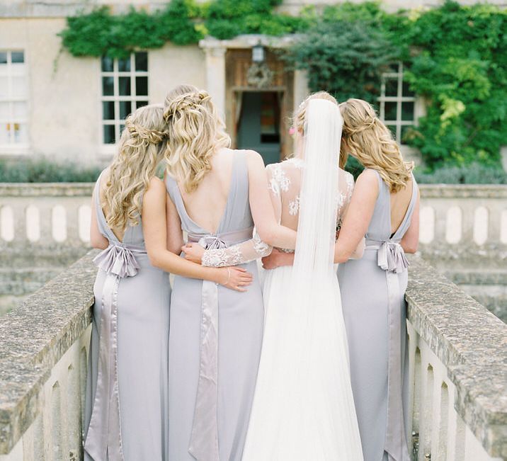 Bridesmaids in Grey Dresses | Bride in Suzanne Neville Camelia Gown | A Romantic Pastel Wedding at Dauntsey Park in the Wiltshire English Countryside | Imogen Xiana Photography