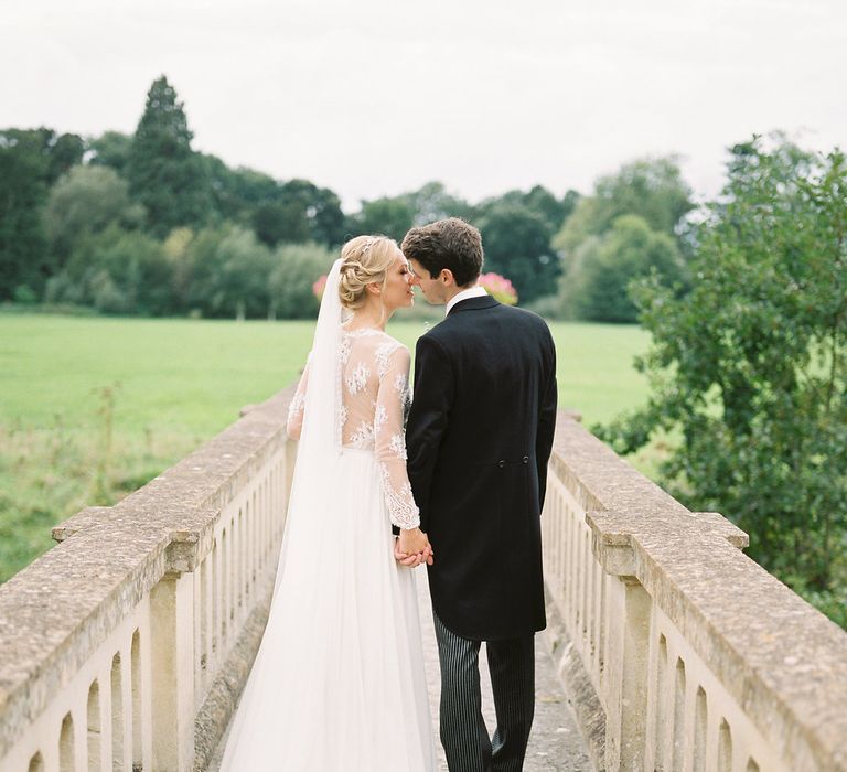 Bride in Suzanne Neville Camelia Gown | Groom in Traditional Tails | A Romantic Pastel Wedding at Dauntsey Park in the Wiltshire English Countryside | Imogen Xiana Photography