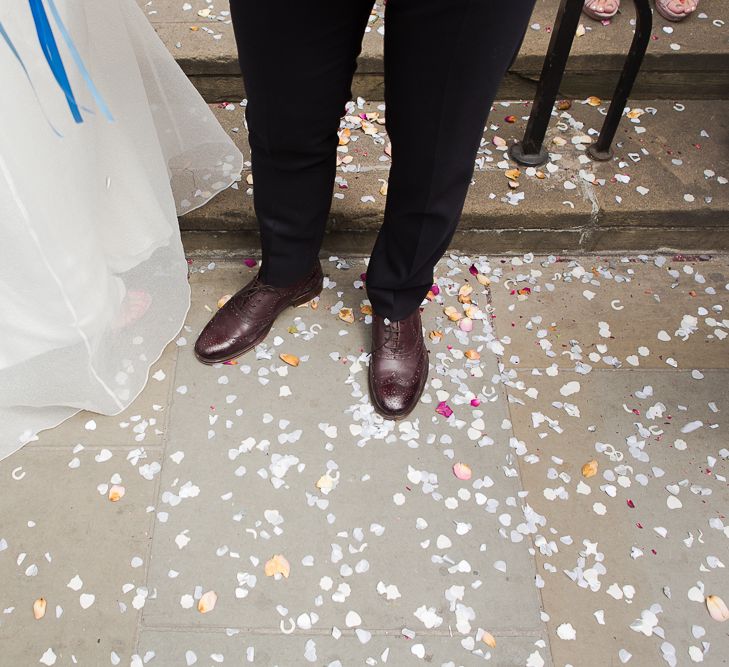 Confetti Moment at Camden Town Hall Wedding Ceremony with Bride in Charlie Brear Wedding Dress, Bright Bouquet & Groom in Paul Smith Suit