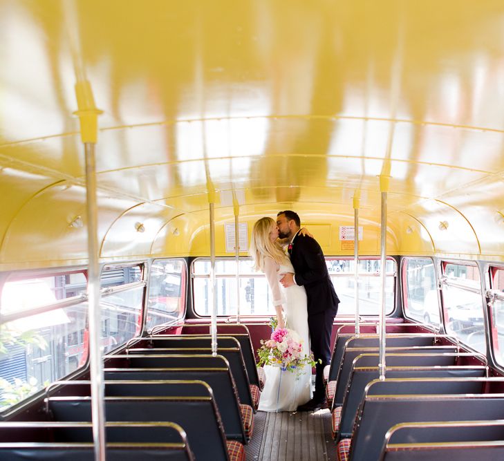 Red Routemaster Bus with Bride in Charlie Brear Wedding Dress, Bright Bouquet & Groom in Paul Smith Suit