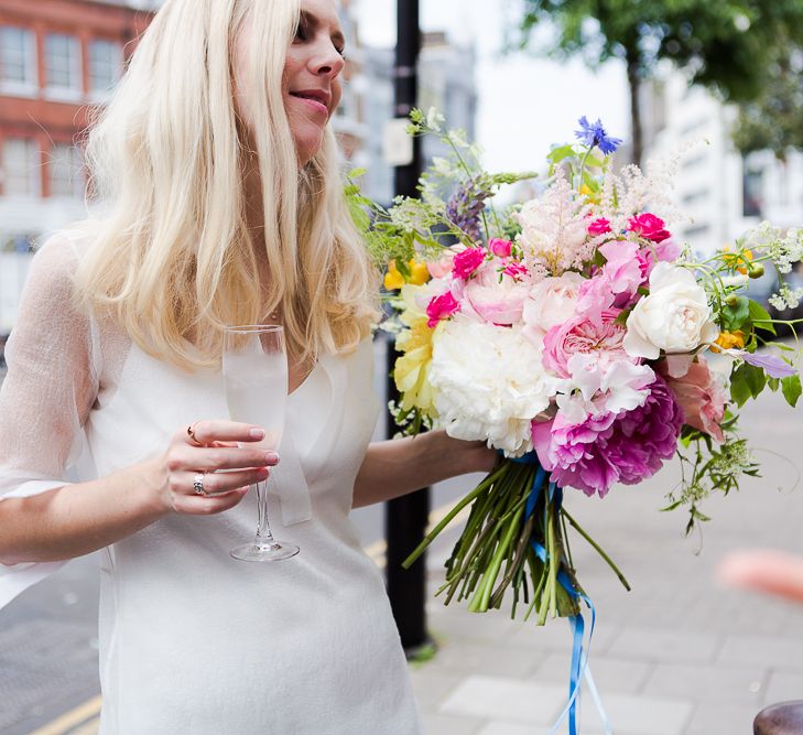 Bride in Charlie Brear Wedding Dress & Bright Bouquet