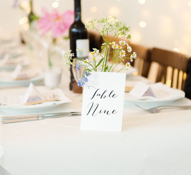 Bright Flower Centrepieces & Fairy Light Backdrop at St JOHN Restaurant & Bar in Clerkenwell London