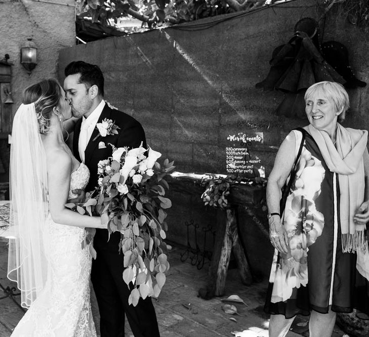 Bride in Essense Designs Wedding Dress | Groom in Simon Dowling Bespoke Suit | Outdoor Ceremony at Boojum Tree in Phoenix, Arizona | Lee Meek Photography