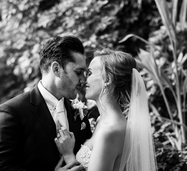 Bride in Essense Designs Wedding Dress | Groom in Simon Dowling Bespoke Suit | Outdoor Ceremony at Boojum Tree in Phoenix, Arizona | Lee Meek Photography