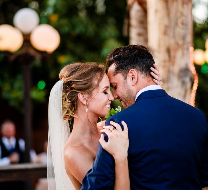 Bride in Essense Designs Wedding Dress | Groom in Simon Dowling Bespoke Suit | Outdoor Ceremony at Boojum Tree in Phoenix, Arizona | Lee Meek Photography