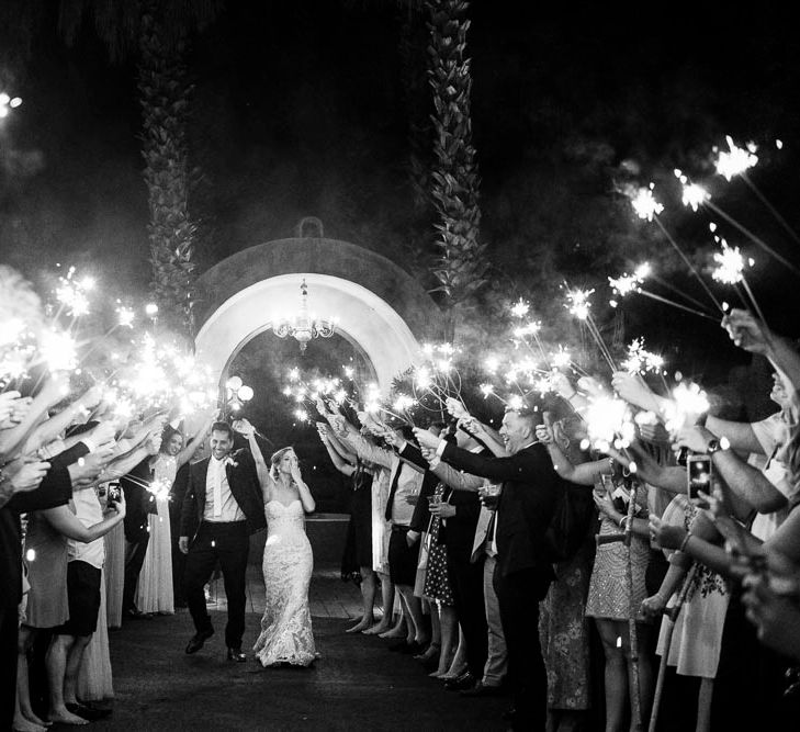 Sparkler Exit | Bride in Essense Designs Wedding Dress | Groom in Simon Dowling Bespoke Suit | Outdoor Ceremony at Boojum Tree in Phoenix, Arizona | Lee Meek Photography