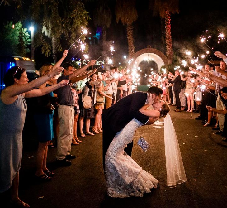 Sparkler Exit | Bride in Essense Designs Wedding Dress | Groom in Simon Dowling Bespoke Suit | Outdoor Ceremony at Boojum Tree in Phoenix, Arizona | Lee Meek Photography