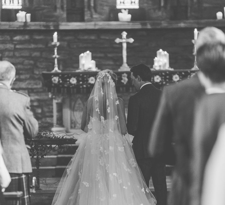 Bride in Bespoke Ian Stuart Gown with Detachable Tulle Skirt at the Altar