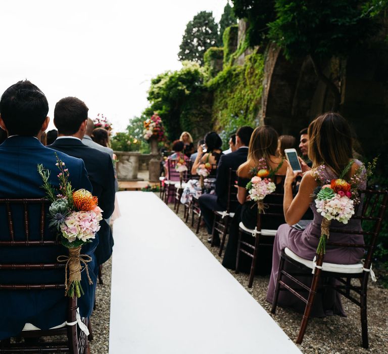 Aisle Chair Back Flowers | Stefano Santucci Studio Photography | Second Shooter Giuseppe Marano | Gattotigre Films