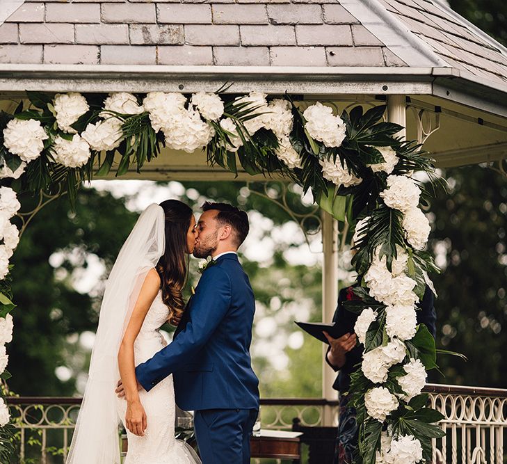 Bride & Groom Portrait under a Floral Arch