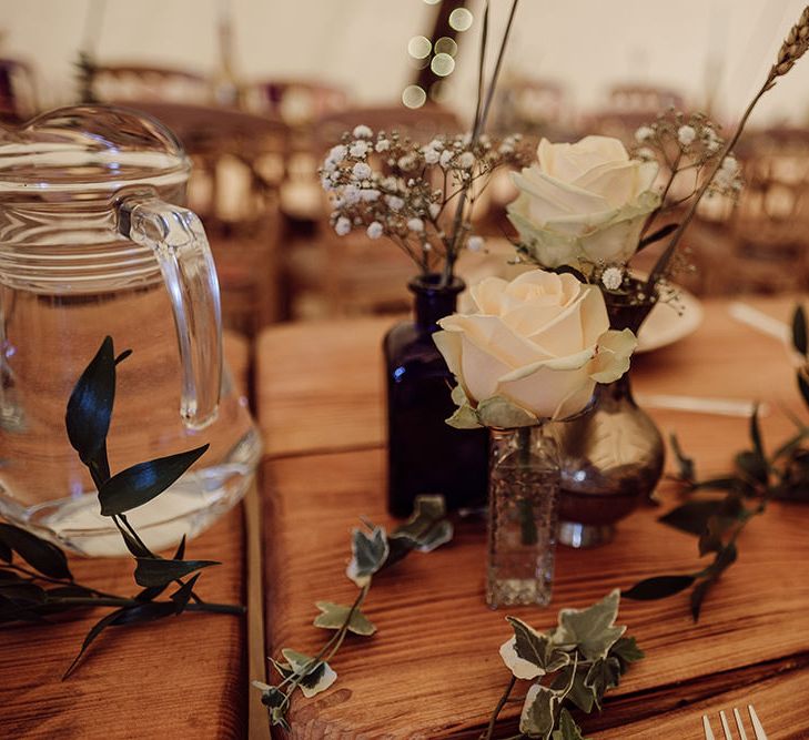 Table Scape with Flower Stems in Jars | Rustic At Home Tipi Reception with Blush Colour Scheme | Jason Mark Harris Photography | Harris Films