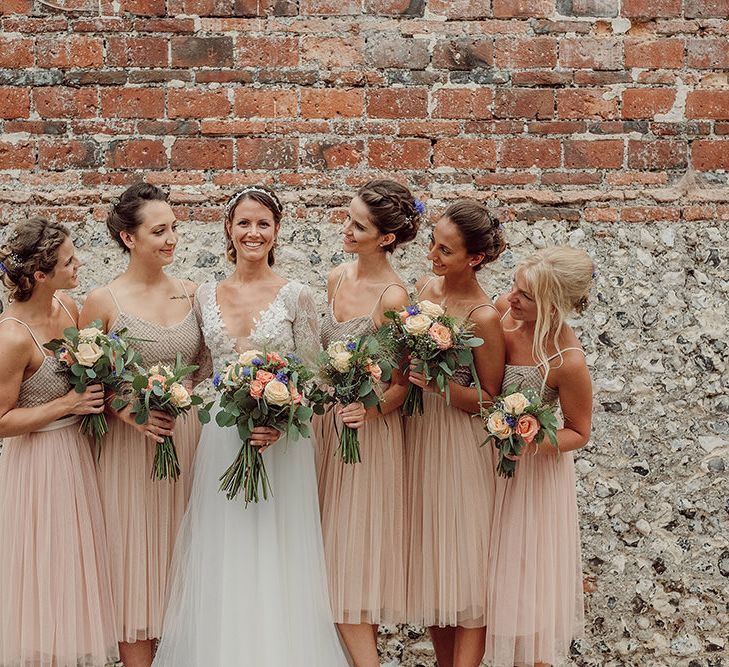 Bridesmaids in Blush Needle & Thread Dresses | Rustic At Home Tipi Reception with Blush Colour Scheme | Jason Mark Harris Photography | Harris Films