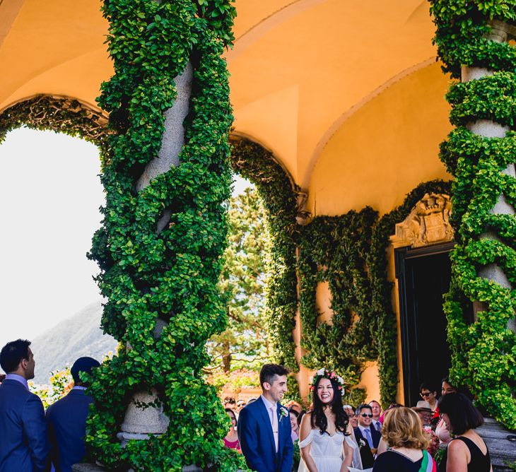 Bride in Tatyana Mereny Wedding Dress and Groom in Thom Sweeney Suit