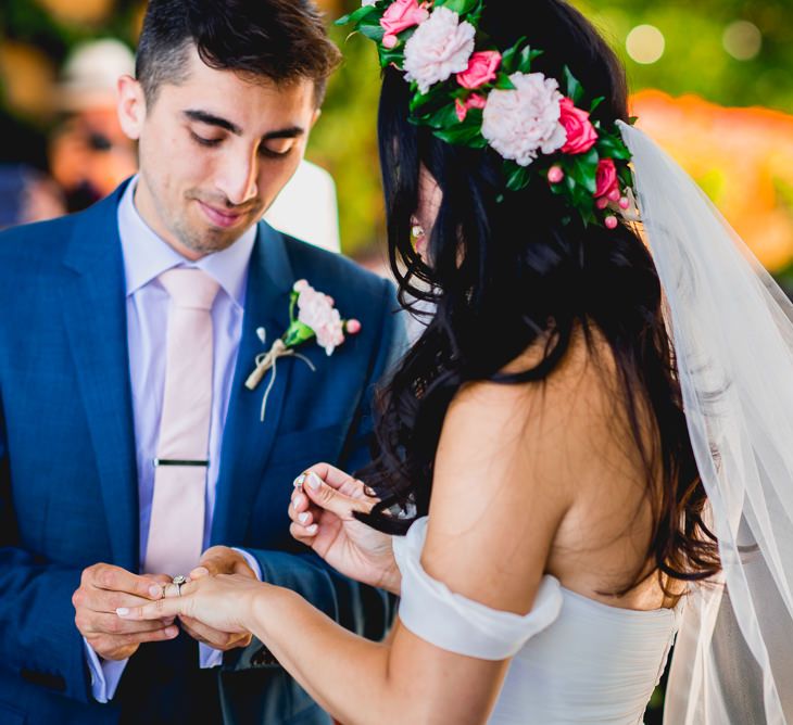 Bride in Tatyana Mereny Wedding Dress and Groom in Thom Sweeney Suit