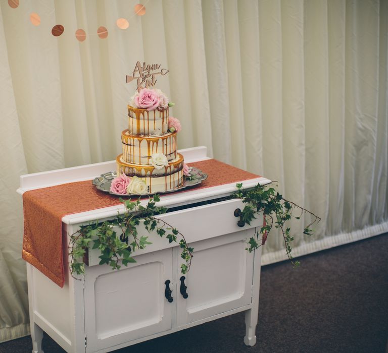 Gold Cake Topper For A Naked Wedding Cake With Drip Icing