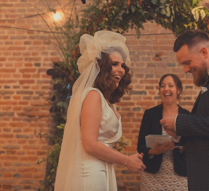 Stylish Bride in Alice Temperley Wedding Dress & Groom in Gucci Suit