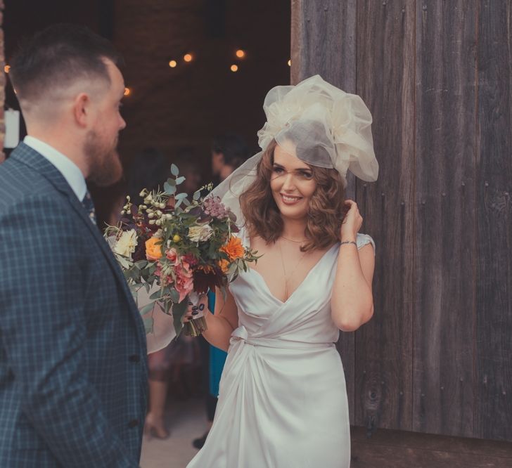 Stylish Bride in Alice Temperley Wedding Dress & Groom in Gucci Suit