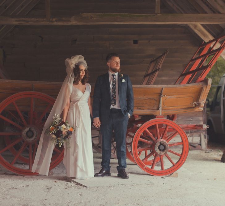 Stylish Bride in Alice Temperley Wedding Dress & Groom in Gucci Suit