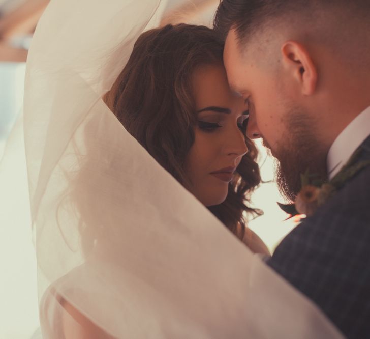 Stylish Bride in Alice Temperley Wedding Dress & Groom in Gucci Suit