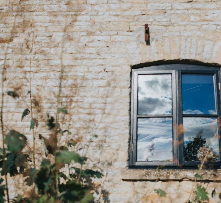 A Cotswold rustic wedding with mismatched bridesmaid dresses