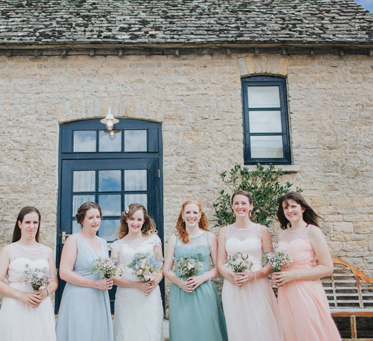 A Cotswold rustic wedding with mismatched bridesmaid dresses