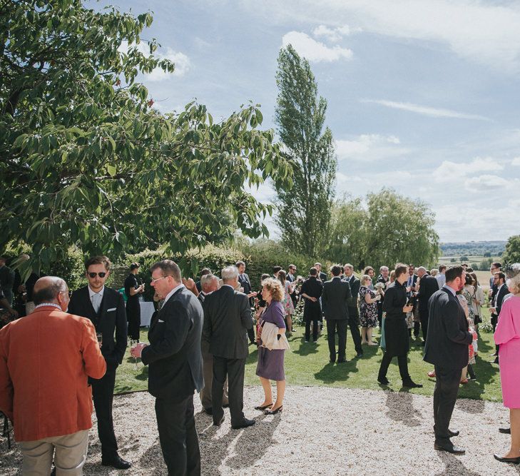 A Cotswold rustic wedding with mismatched bridesmaid dresses