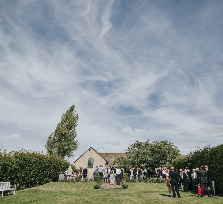 A Cotswold rustic wedding with mismatched bridesmaid dresses