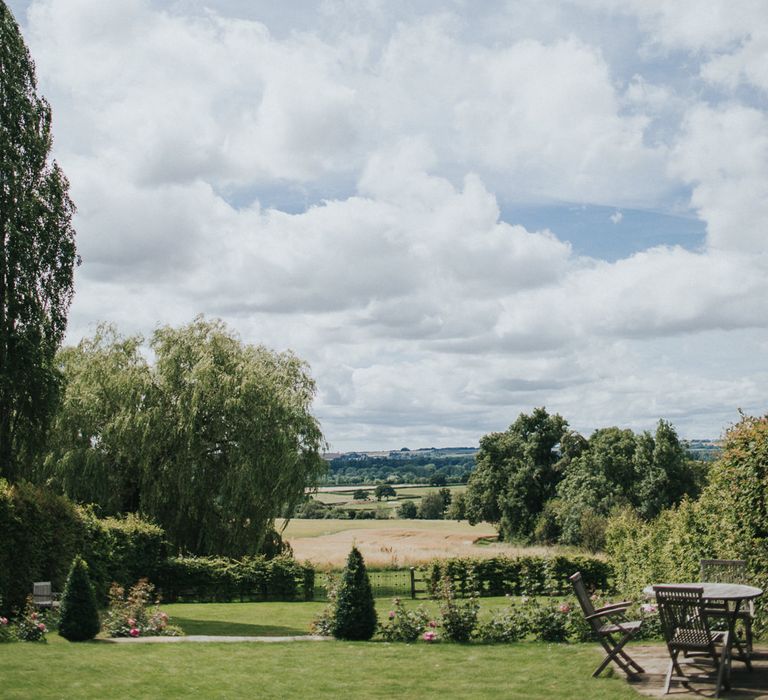 A Cotswold rustic wedding with mismatched bridesmaid dresses