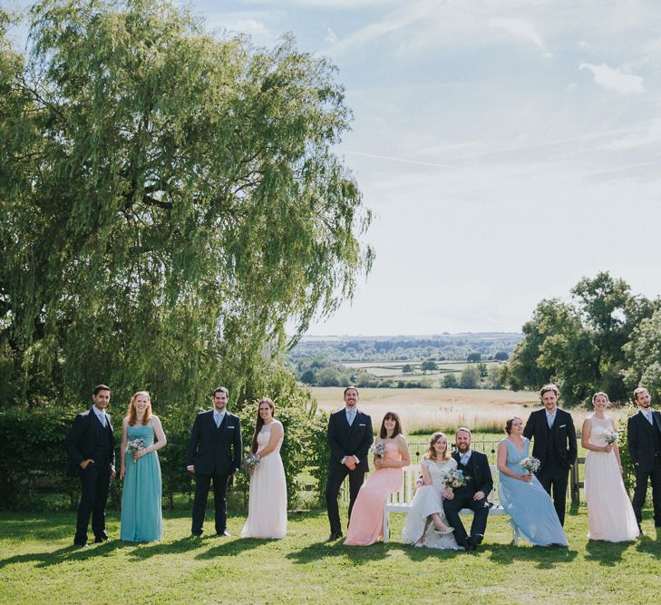 A Cotswold rustic wedding with mismatched bridesmaid dresses