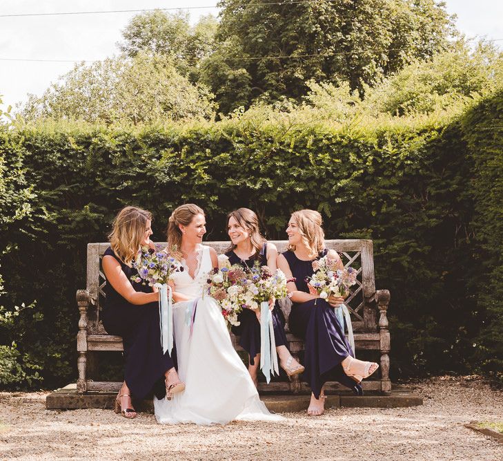 Bridal Party | Bride in Charlie Brear Gown | Bridesmaids in Navy Phase Eight Dresses | Outdoor Ceremony at Sulgrave Manor Northamptonshire | Nicola Casey Photography