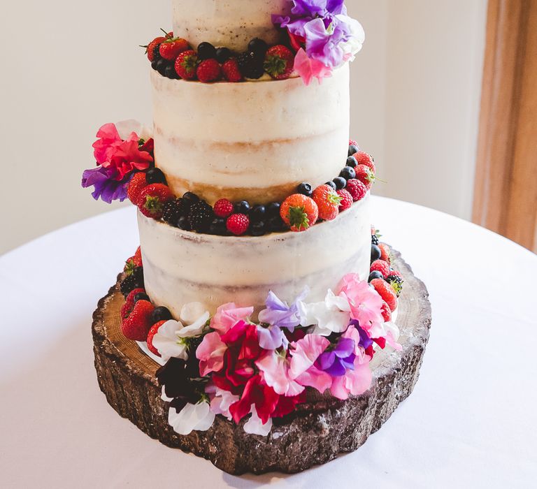 Semi Naked Wedding Cake with Fruit & Flower Decor | Outdoor Ceremony at Sulgrave Manor Northamptonshire | Nicola Casey Photography